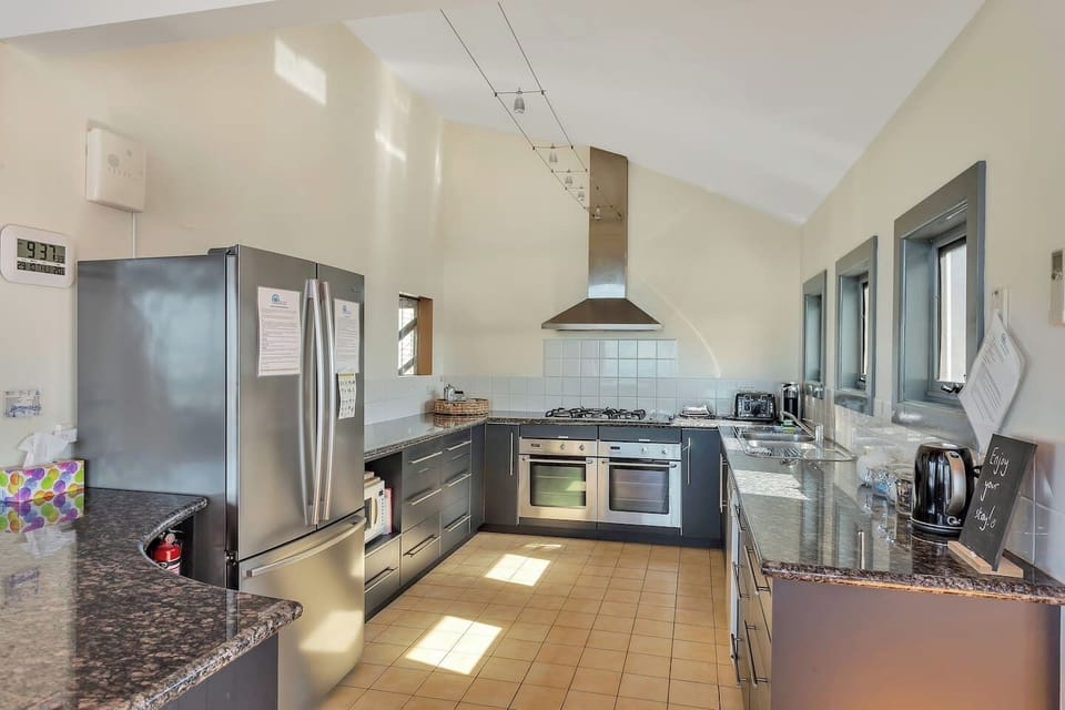 Premium kitchen with two ovens, huge fridge and bench space.