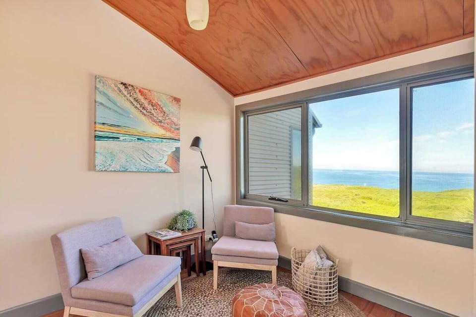Cozy reading nook with stunning water views