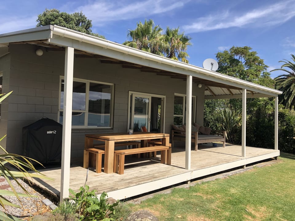 Large outdoor table for whole family, with Weber BBQ - all under cover