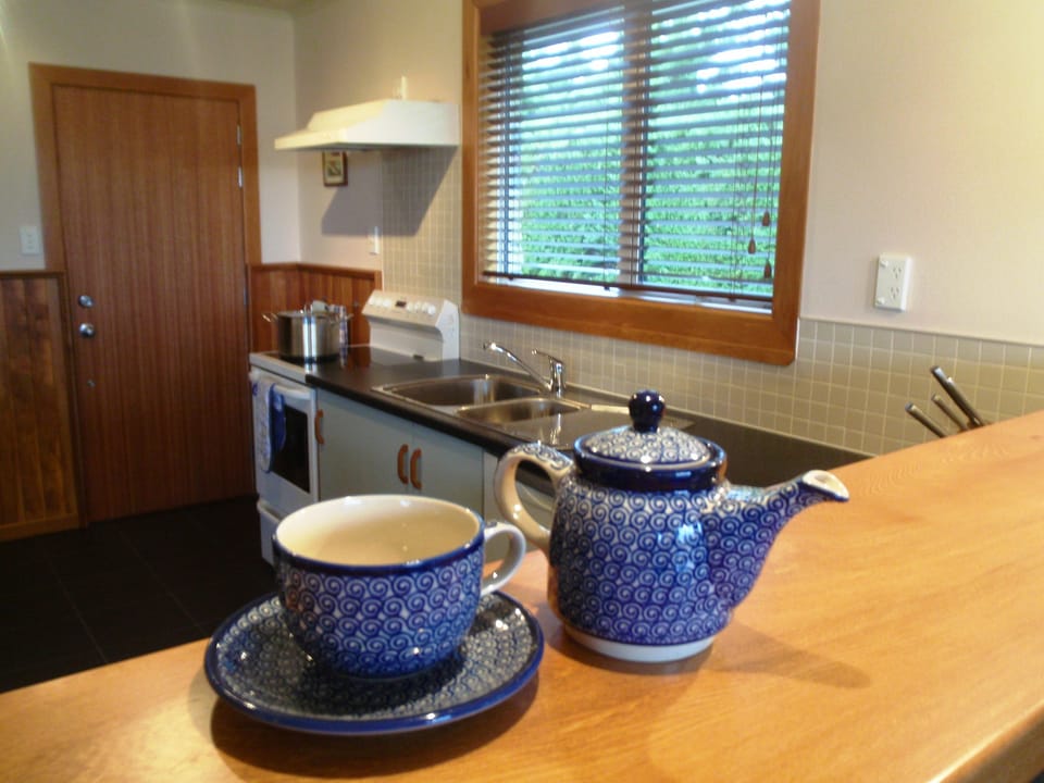 A modern kitchen is equipped with all the items for preparing delicious meals. 
