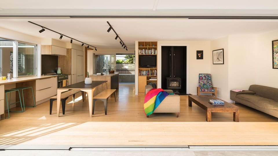 Main living space and kitchen opens up to front and back deck