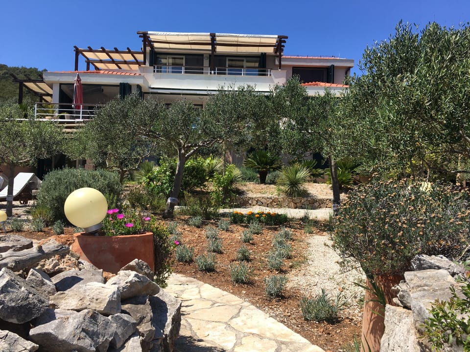 when you step down to the beach, turn back - and this is your villa Tempera 