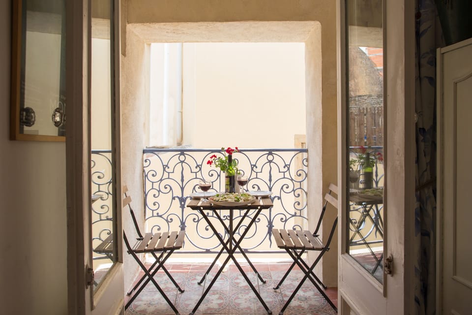 Sunny balcony where you can have a glass of wine and watch village life go by
