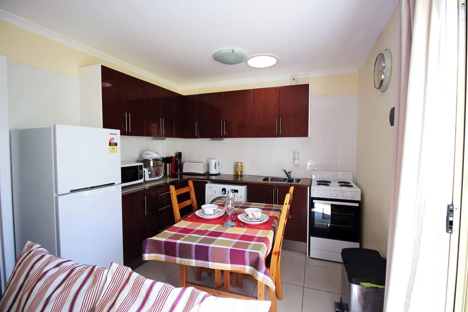 Kitchen with stove and oven and additional countertop oven