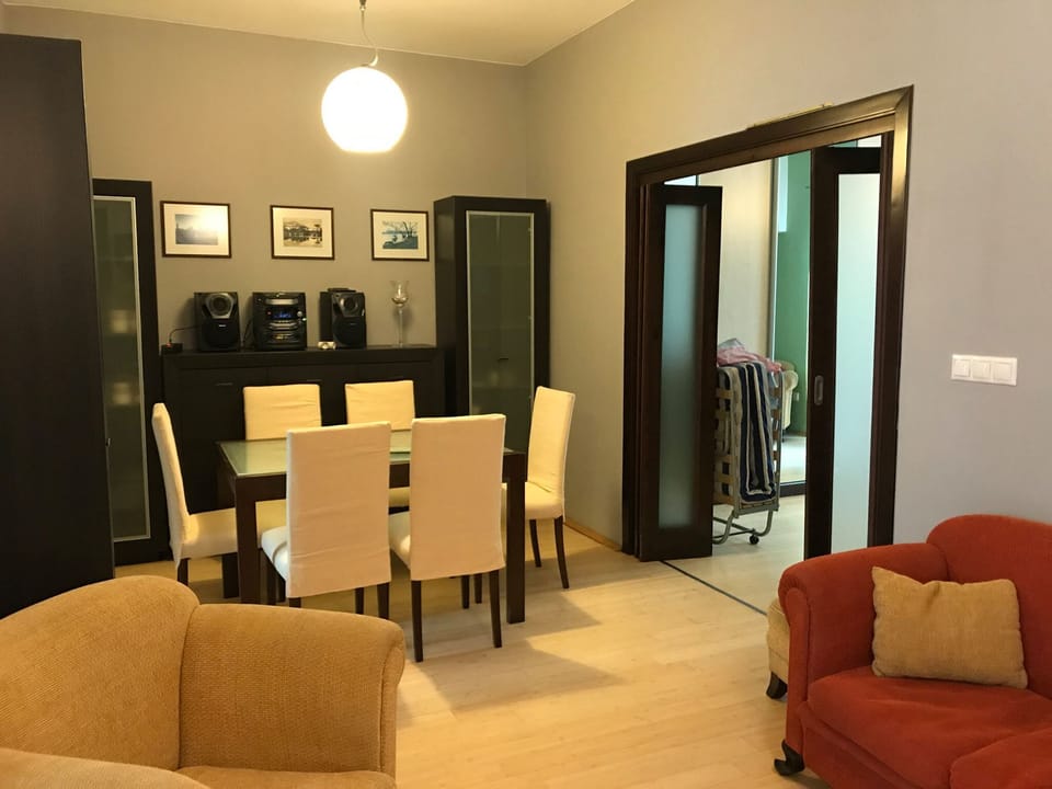 Entrance to master bedroom to the right of dining table.