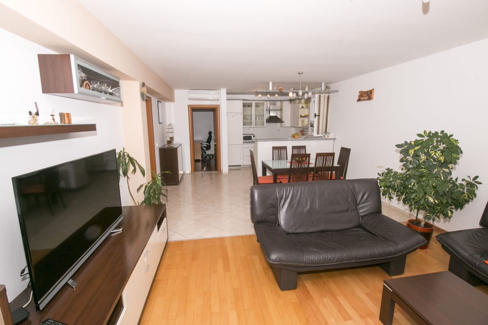 There is also a dining table, sofa bed and TV.