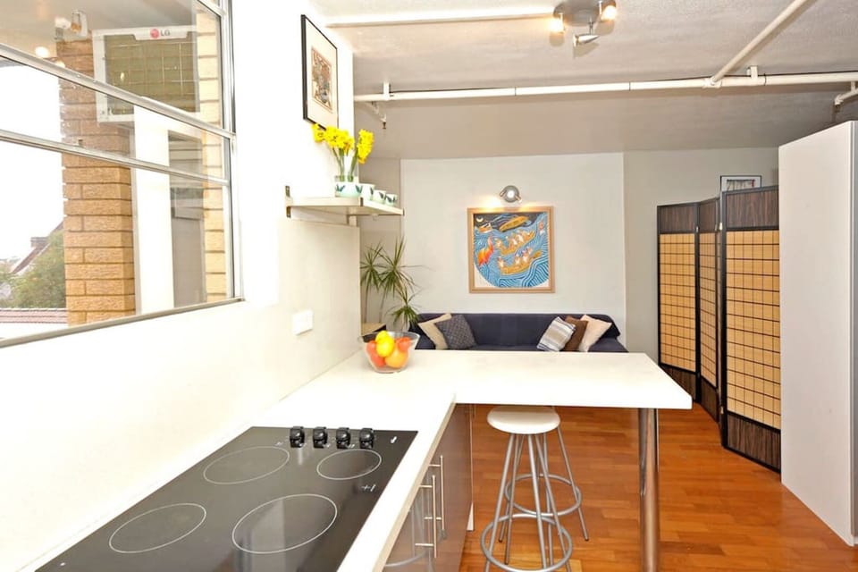 View from kitchen to living and sleeping areas