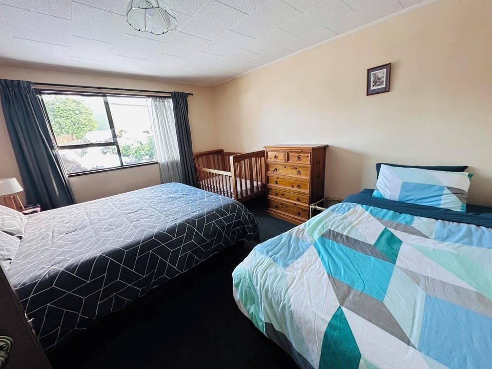 Downstairs bedroom - 1x King and 1x King Single bed (both new beds). 1x cot
