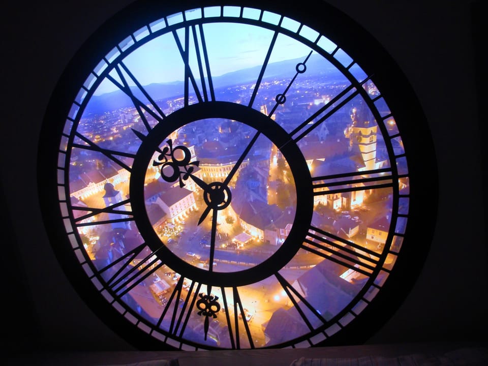 Decorative clock overlooking Main Square in Sibiu