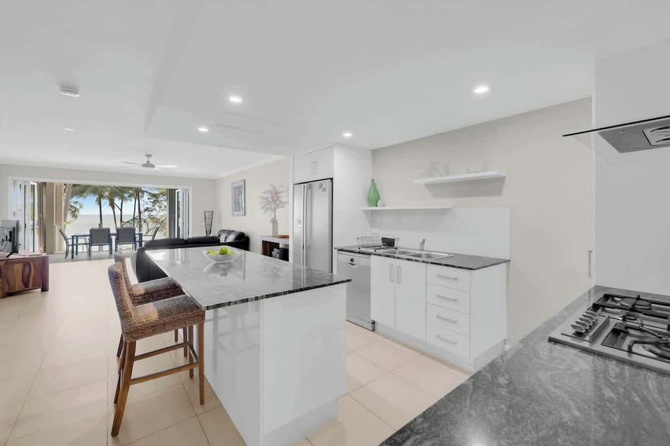 The kitchen centres around an island bench where you can sit and converse with the cook.