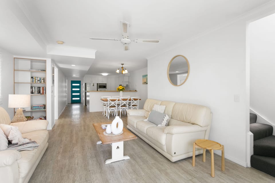 spacious living area including dining area and kitchen.
