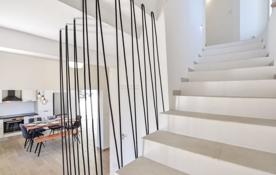 Upper floor stairs. 2 bedrooms and 2 bathrooms are upstairs.