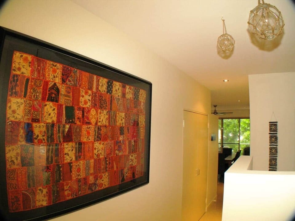 Beach House Apartment No 7 - Wall art - hallway from front door to living/kitchen/dining. 