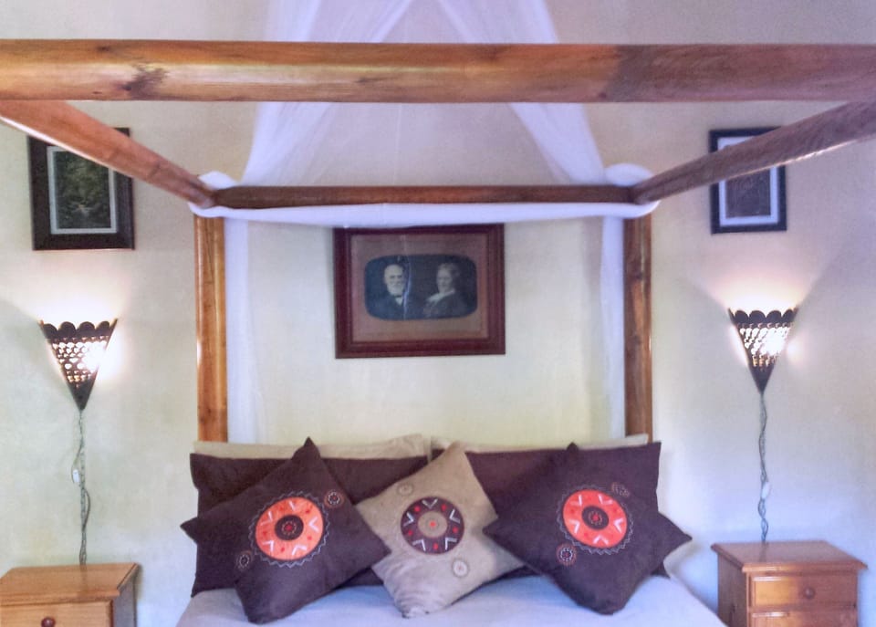 Four Poster Double Bed with mosquito net.