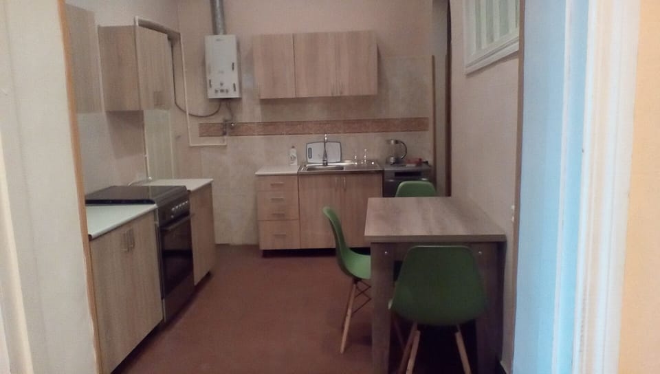 Kitchen. To the far right in the back there is a large storage cellar.