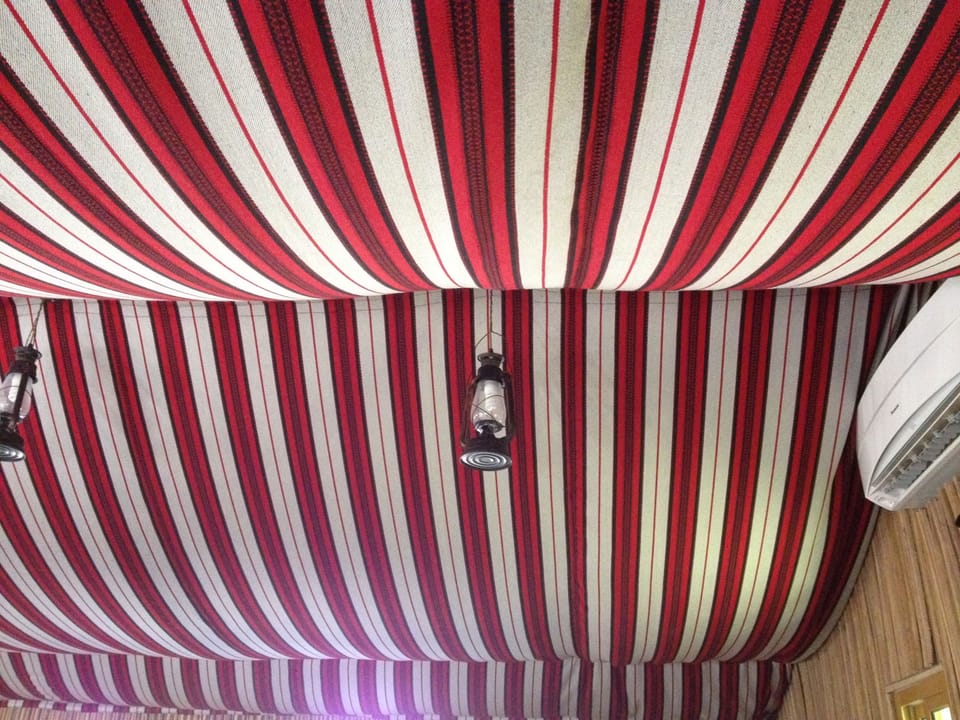 Traditional fabric tented ceiling in reception majlis
