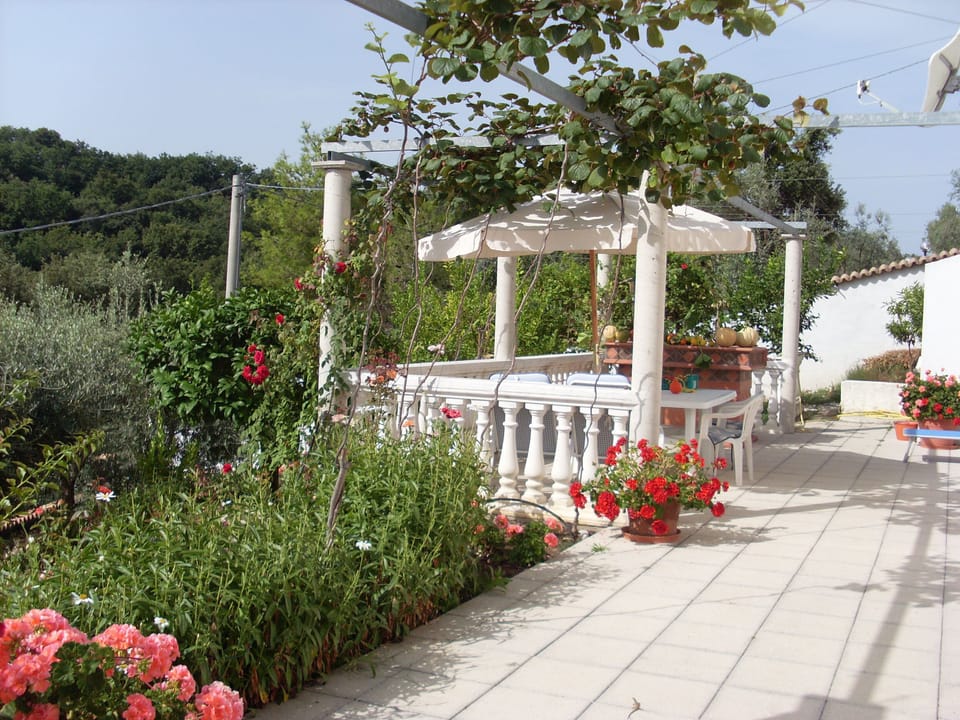 Guests private terrace in front of apartment and view into the nature