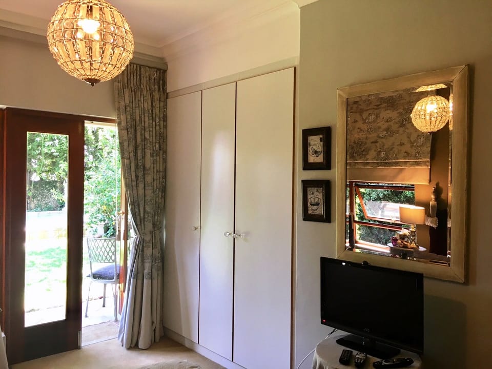 Bedroom door opens onto garden and pool area