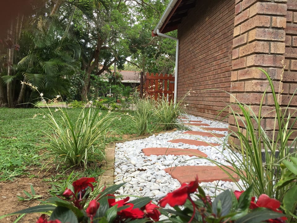 Private back garden with pathway leading to patio