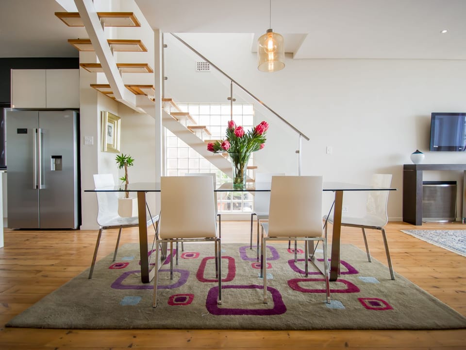 Dining area and stairs leading to the first floor level