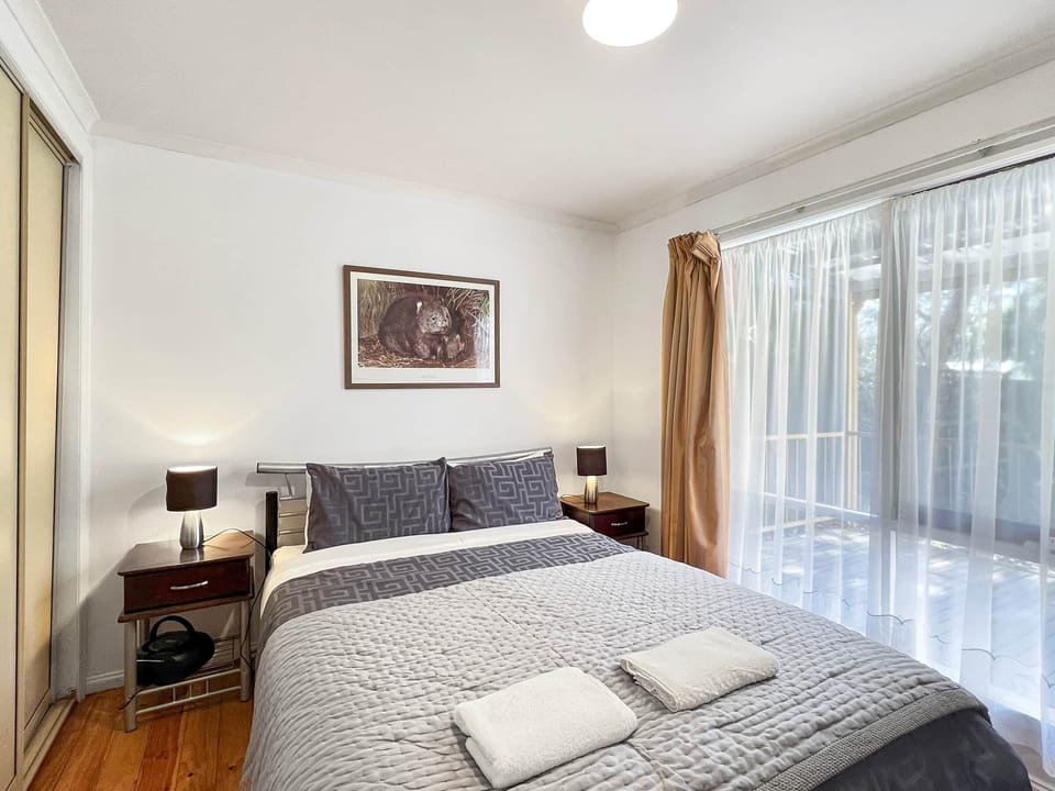 Chic comfort: Bedroom 2 featuring a luxurious queen bed. Your serene retreat.