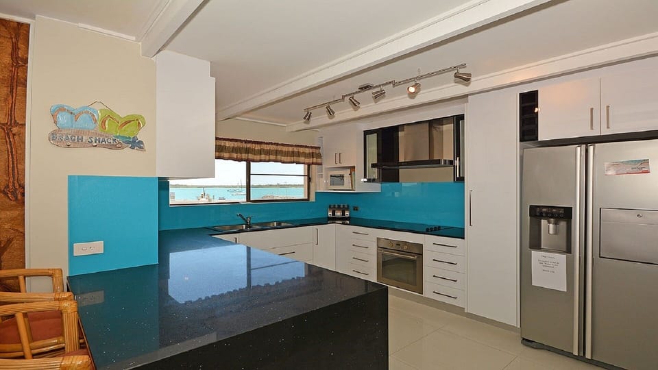 The newly renovated downstairs white gloss & granite gourmet kitchen