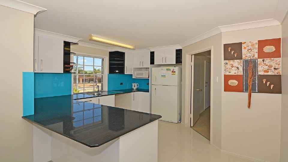 Upstairs white gloss & granite kitchenette with sink, m/w, fridge & kettle