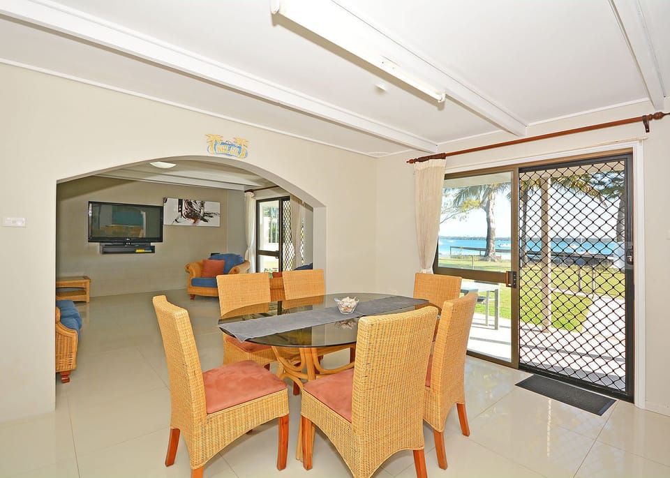 Modern downstairs dinning leading onto the back entertainment area.