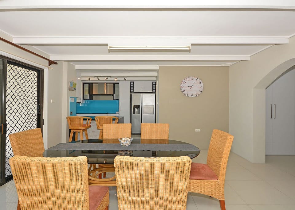 Modern downstairs dinning in-between the kitchen and lounge areas area.
