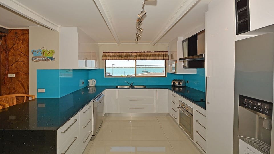 Downstairs modern kitchen with s/s m/w, dishwasher, oven and double door fridge