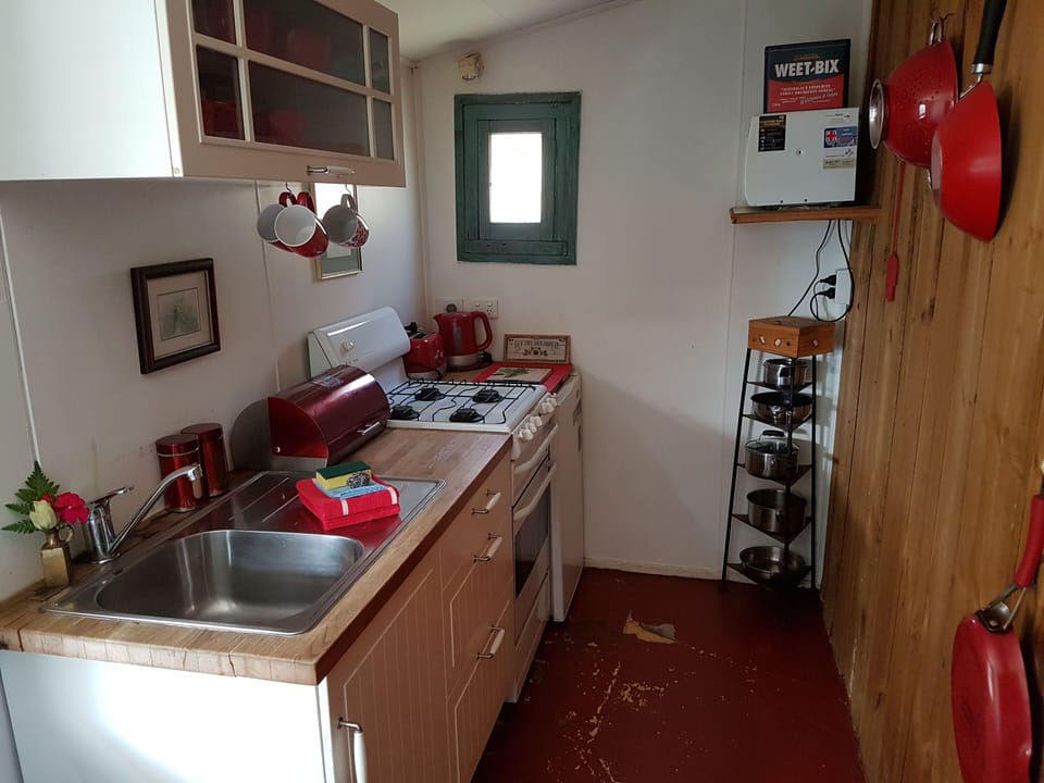 The kitchen opens onto the half covered courtyard with BBQ and fire pit.