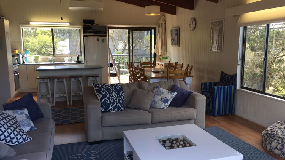 Upstairs family room with kitchen overlooking back garden 