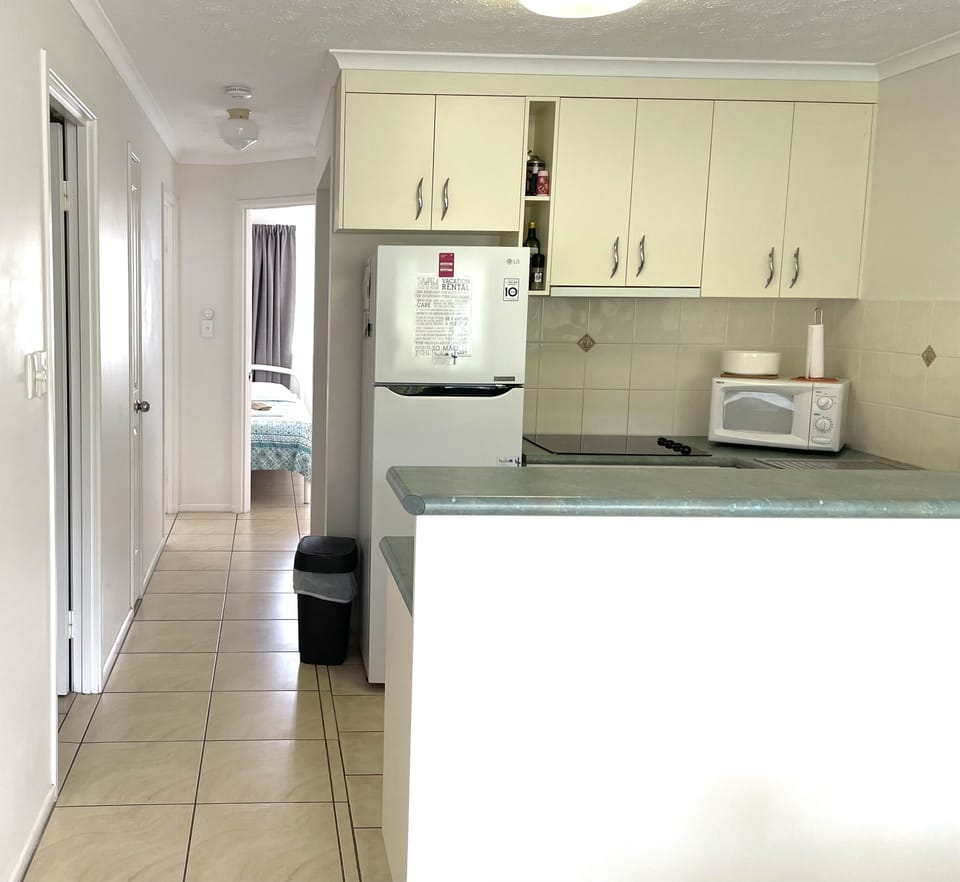 View from dining through kitchen towards bedrooms