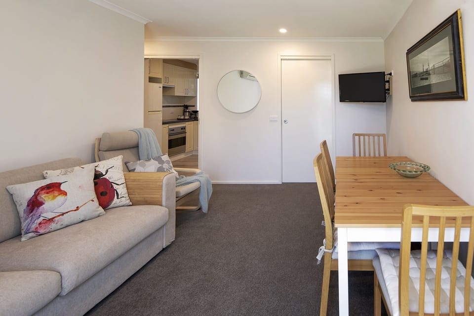 A cosy living area with access via sliding door to garden
