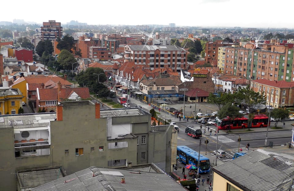 View towards the west. The red bus belongs to the transmilenio system.