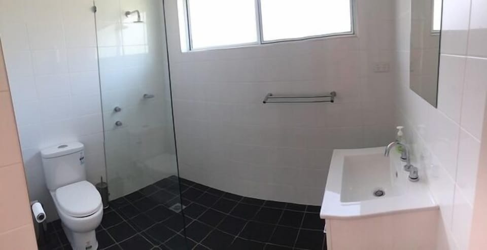 WASH - a modern open plan bathroom to clean up at the end of a busy day