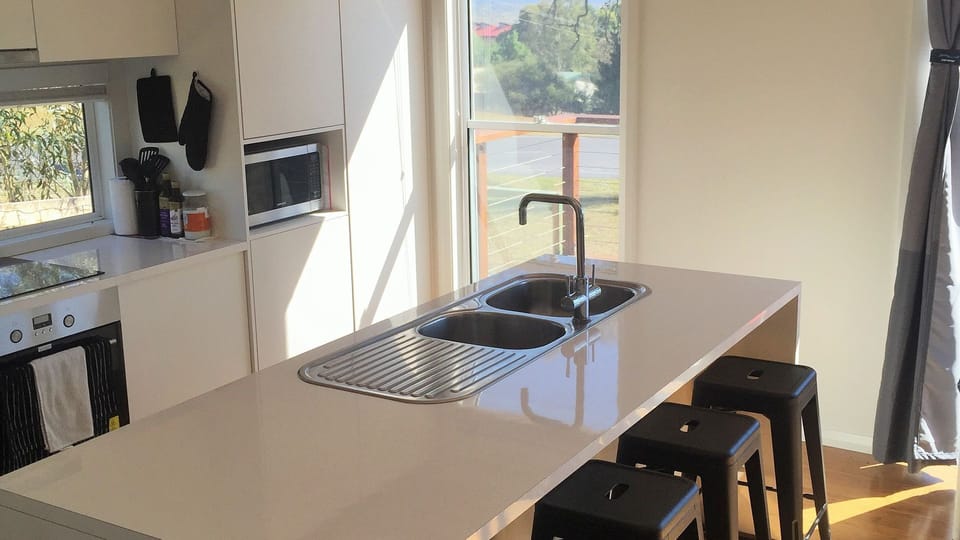 YUM - enjoy prepping your meals in a kitchen with lots of natural light. 