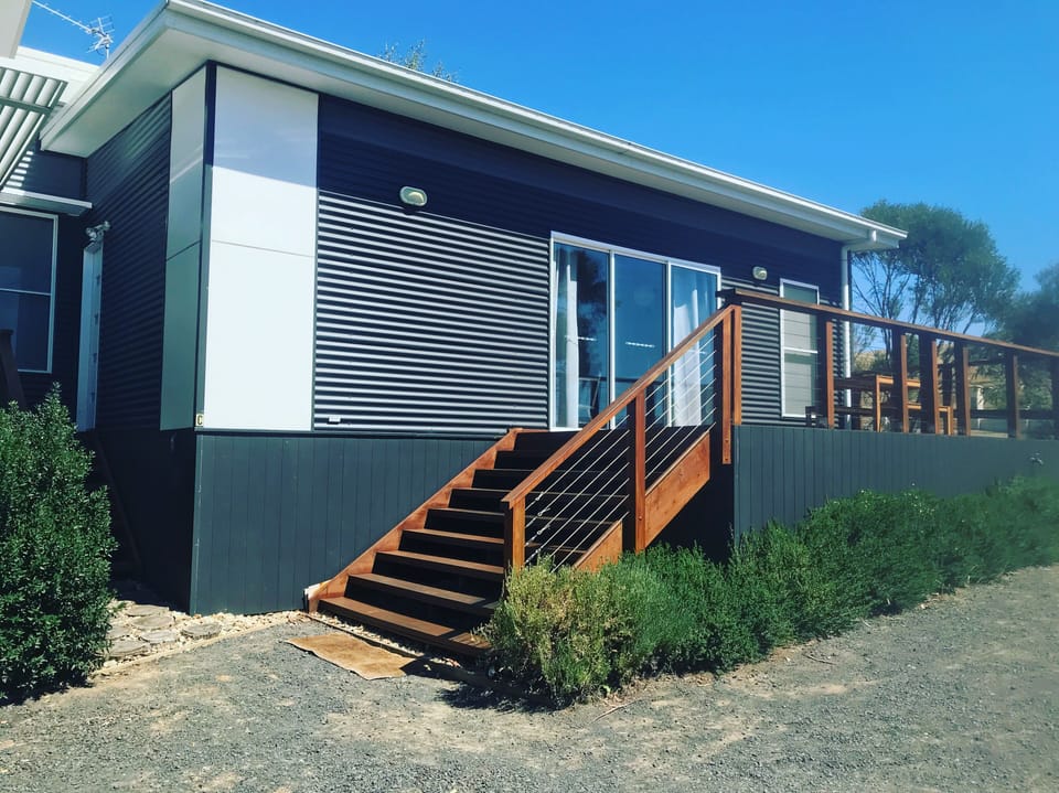 WOOF - fenced yard with easy access for your pets and a spot to wash your bike.