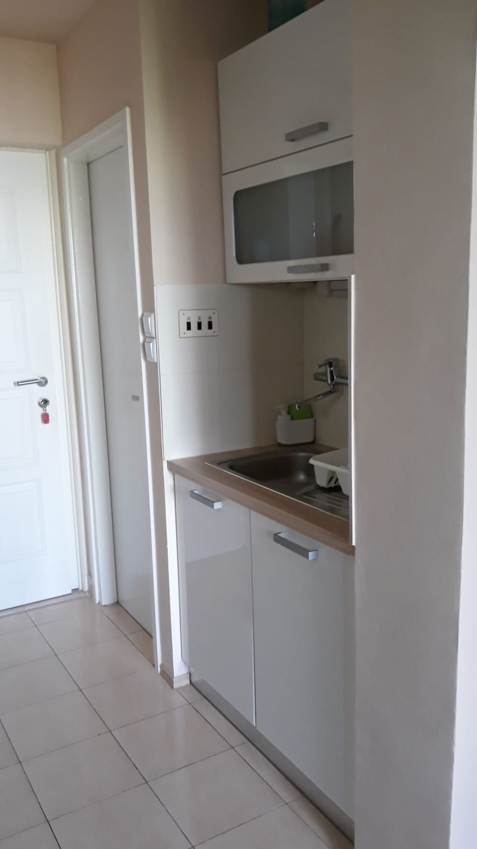 Entrance door and toilet door to the right side.