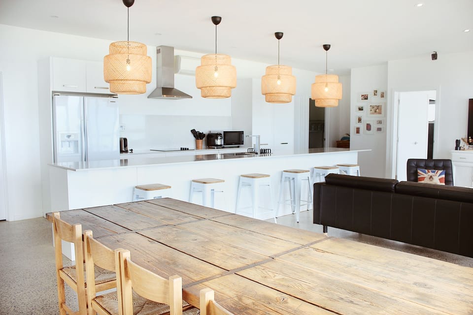 Dining area- Large table with 4 chairs + long bench seat. Sits up to 11 people