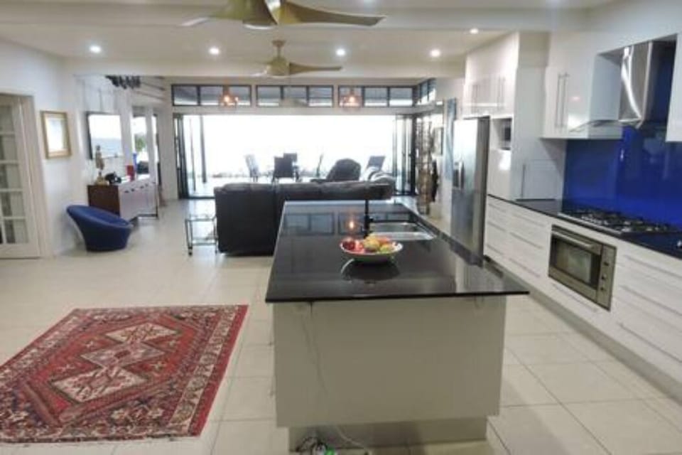 Large open-plan main living space with well equipped kitchen & modern appliances