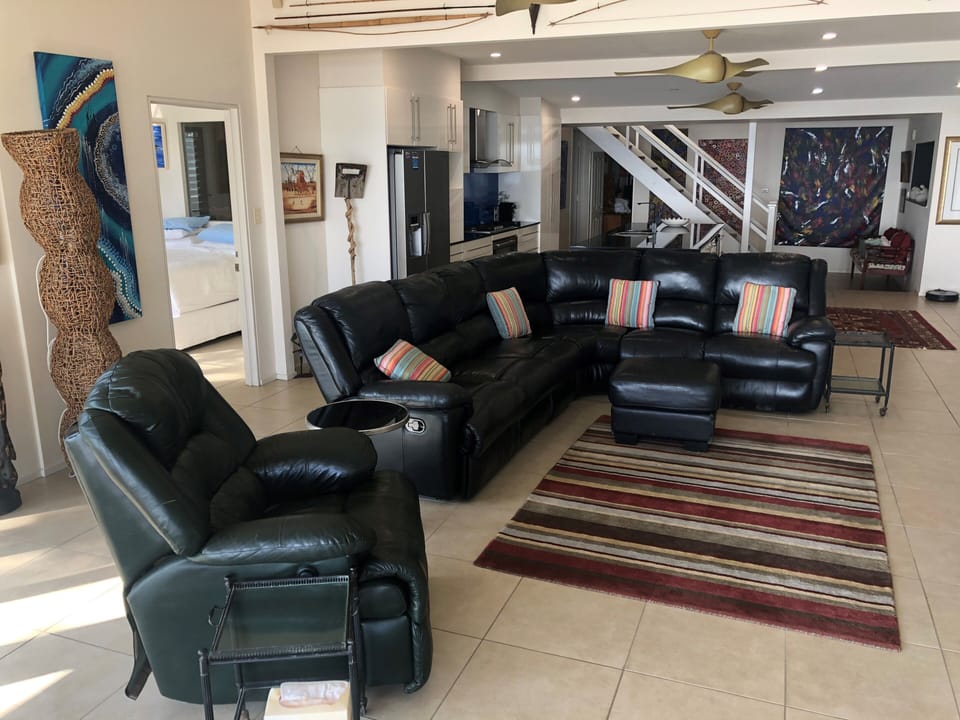 Comfortable recliner lounge and glass coffee tables. Wide screen TV/DVD player. 