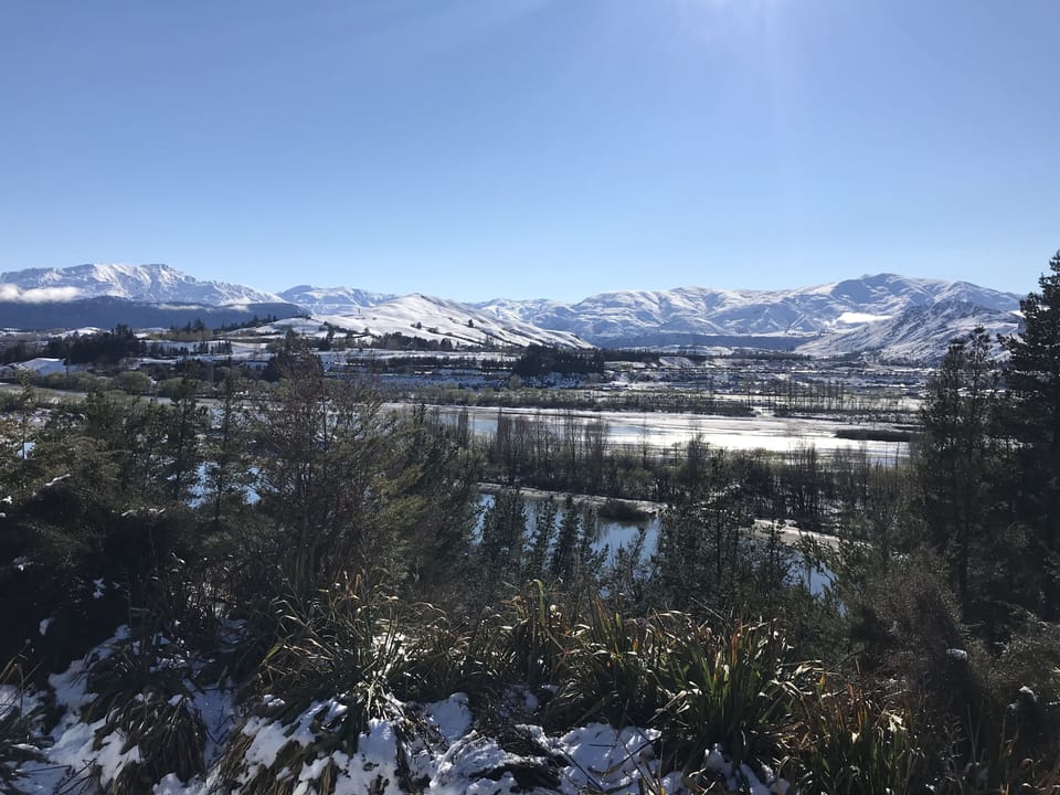 Cardrona Ski Field in the distance behind the Shotover River from the Deck