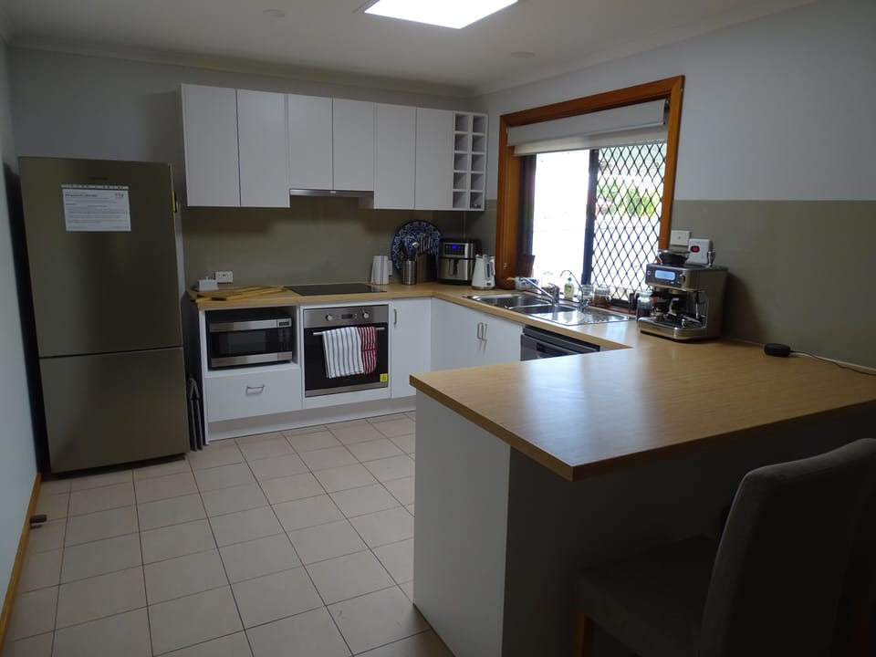 Full kitchen with dish washer, coffee maker and air fryer