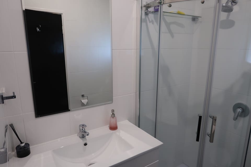 Modern petite bathroom with all the essentials including overhead heating