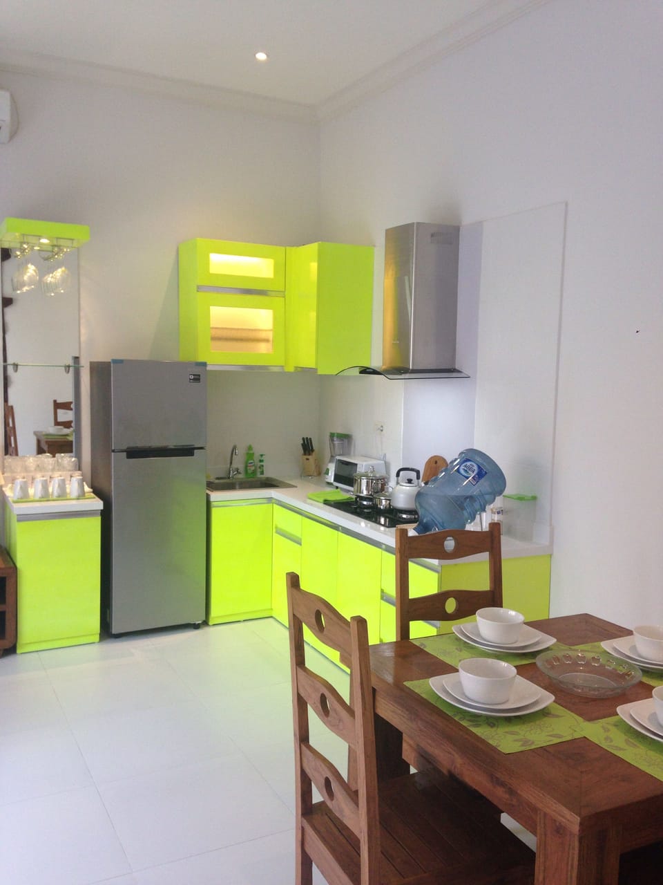 Dining kitchen, essential cooking equipment and dining table for 4 guests 