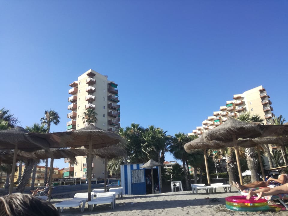 the beach is in front of the building