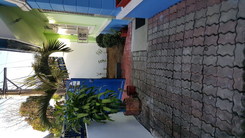 outside the main door inside the gate