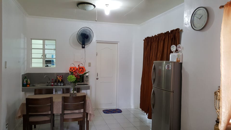 dining area with small kitchenette with running water...can be use as a bar desk