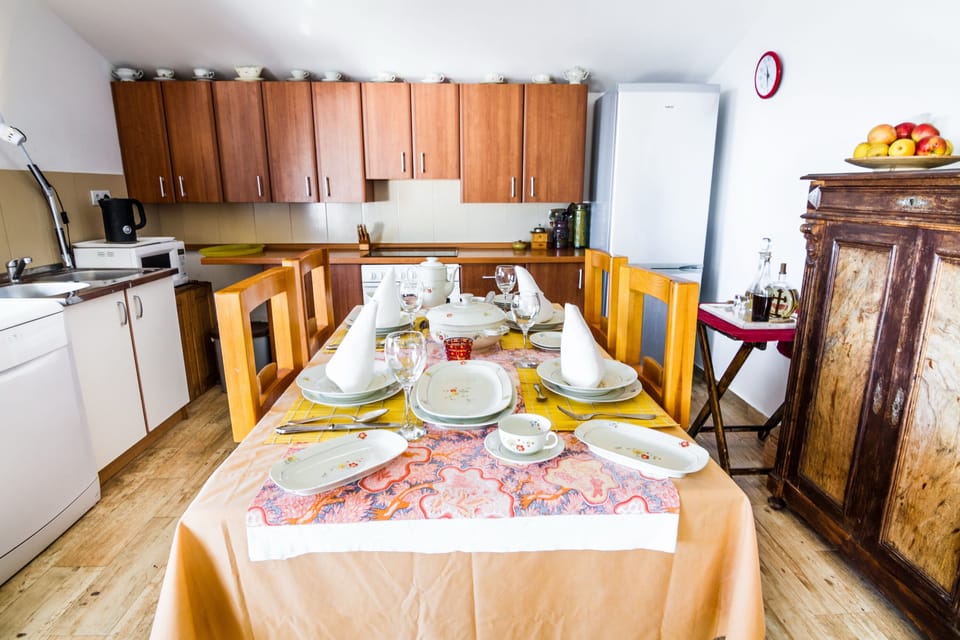 A fully equipped kitchen with all necessary utensils is available. 
